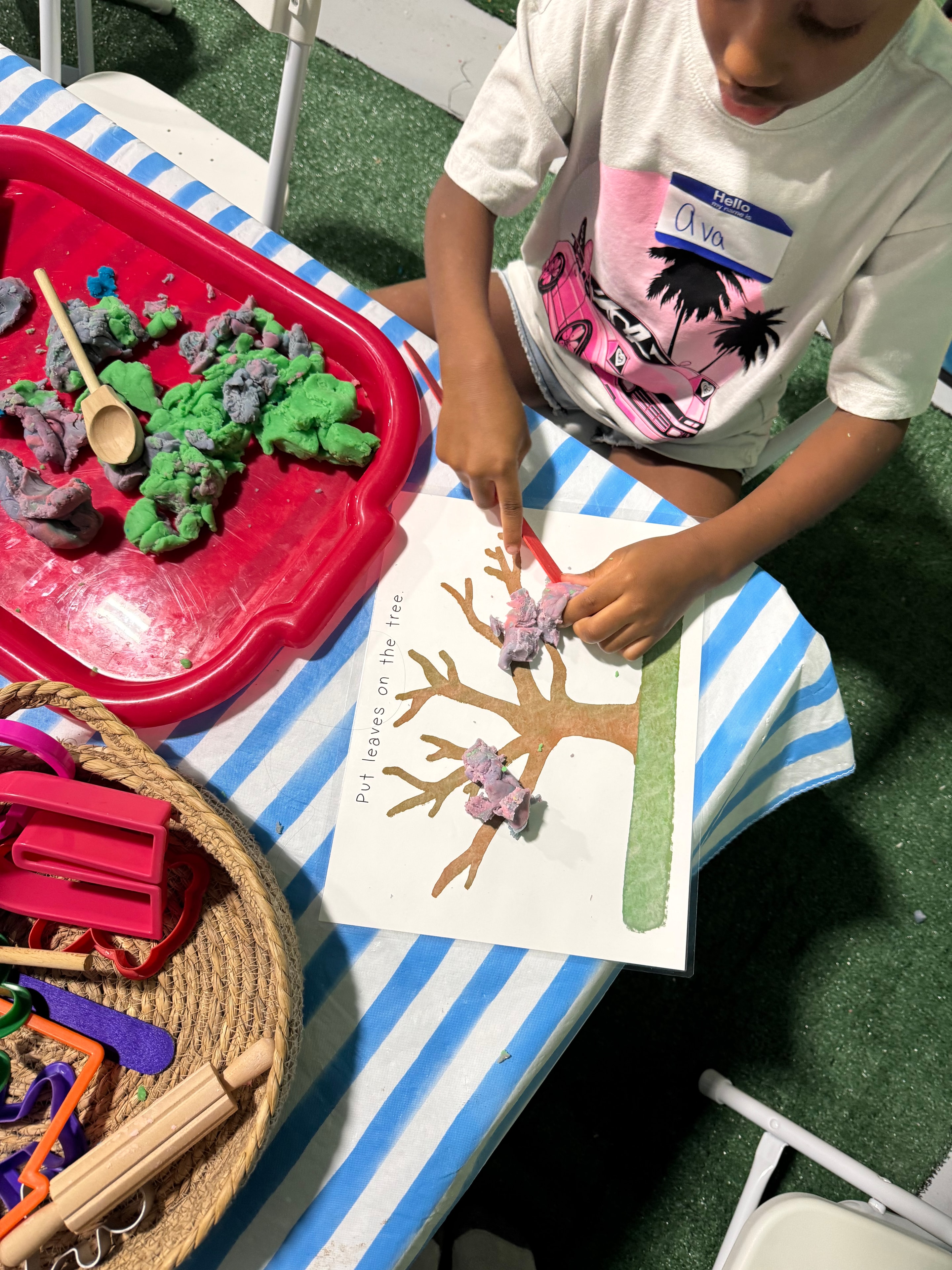 Ice painting with colorful paint and brushes at Sincerely Sensory